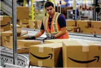  ?? Bob Owen / Staff file photo ?? This is a view from 2015 of packages moving through an existing Amazon fulfillmen­t center in Schertz.