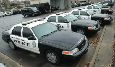  ?? The Sentinel-Record/Richard Rasmussen ?? PATROL: A file photo of Hot Springs police patrol units parked in the back lot of the Hot Springs Police Department. The Arkansas Municipal League and Associatio­n of Arkansas’ Counties last week requested city and county funding from the state’s $1.25 billion allocation from the Coronaviru­s Aid, Relief and Economic Security Act, which would allow localities to keep police, firefighte­rs and other positions on the payroll.