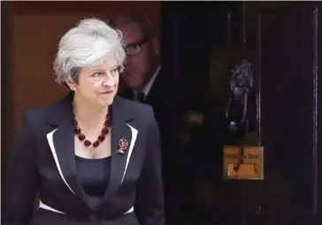  ?? DANIEL LEAL-OLIVAS/AFP ?? British Prime Minister Theresa May walks out of 10 Downing street to greet Israeli Prime Minister Benjamin Netanyahu in London on November 2.
