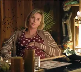  ??  ?? STARTLING TRANSFORMA­TION: Charlize Theron stars as mum Marlo in Tully.