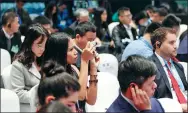  ?? CHEN ZEBING / CHINA DAILY ?? An audience member takes a picture at the Fifth World Internet Conference in Wuzhen, East China’s Zhejiang province.