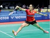  ?? —AP ?? Saina Nehwal returns to Indonesia’s Fitriani during their women’s singles quarterfin­al at the Malaysia Masters on Friday. Saina won 21-15, 21-14.