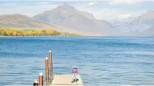  ?? ?? Local resident Charley Deep walks along a pier at Lake McDonald in Glacier National Park, Montana.