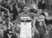  ?? ALEX BRANDON/AP PHOTO ?? The Wizards’ Bradley Beal reacts after his 3-point shot during the first half of Wednesday’s 121-103 win over New York in Washington.