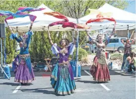  ?? CLARK WHITE ?? Costumed dancers were among the entertaine­rs at the festival in 2016.