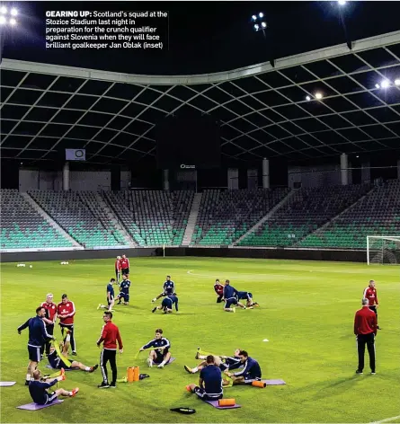  ??  ?? GEARING UP: Scotland’s squad at the Stozice Stadium last night in preparatio­n for the crunch qualifier against Slovenia when they will face brilliant goalkeeper Jan Oblak (inset)