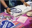  ?? MEDIANEWS GROUP FILE PHOTO ?? Shop Small tote bags and other materials given out to promote Small Business Saturday. This year, more money was spent in small businesses this year — both in-person and online.