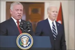  ?? AP photo ?? Jordan’s King Abdullah II speaks as President Joe Biden listens in the Cross Hall of the White House on Monday in Washington.