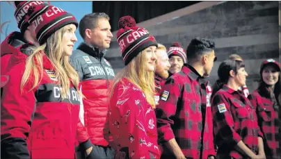  ?? CHRIS DONOVAN/THE CANADIAN PRESS ?? Olympic hopefuls for 2018 show off Hudson Bay Company’s new line of Olympic gear at the Eaton Centre in Toronto on Tuesday.