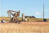  ?? MATTHEW BROWN AP ?? A pumpjack extracts crude oil for the Dakota Access Pipeline on the Fort Berthold reservatio­n Tuesday.