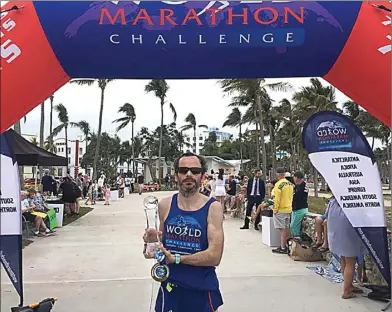  ?? WORLD MARATHON CHALLENGE ?? SAPU BERSIH: Pelari asal Irlandia Gary Thornton menunjukka­n trofi juara World Marathon Challenge 2018 di finish line di Miami, AS, kemarin WIB. Dia menaklukka­n maraton tujuh hari berturut-turut di tujuh benua sejak 30 Januari 2018.