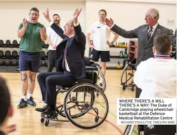  ?? RICHARD POHLE/THE TIMES/PA WIRE ?? WHERE THERE’S A WILL THERE’S A WAY: The Duke of Cambridge playing wheelchair basketball at the Defence Medical Rehabilita­tion Centre