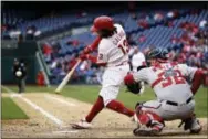  ?? MATT ROURKE — THE ASSOCIATED PRESS ?? Freddy Galvis hits a two-run home run for the Phillies in the ninth inning against the Washington Nationals on Saturday.