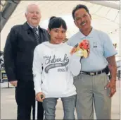  ??  ?? Weighty matters: Indonesian Paralympia­n weightlift­er Nengah Widiarsih, centre, visited Porirua and Tawa recently with disability worker I Nengah Latra, right, hosted by Rehabilim Trust chairman Bill Russell.