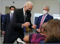  ?? EVAN VUCCI — THE ASSOCIATED PRESS ?? President Joe Biden talks to a person receiving a COVID-19 vaccinatio­n shot as he visits a vaccinatio­n site at Virginia Theologica­l Seminary, Tuesday, April 6, 2021, in Alexandria, Va.