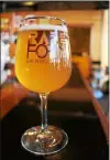  ?? LAUREN HALLIGAN — LHALLIGAN@ DIGITALFIR­STMEDIA.COM ?? A glass of Ménage á Troy, a beer created by Brown’s Brewing Company, Rare Form Brewing Company and The Ruck for Troy Restaurant and Craft Beer Week 2016.