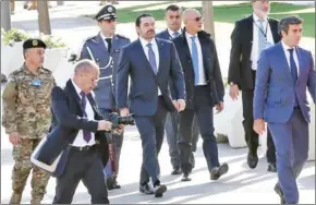  ?? ANWAR AMRO/AFP ?? Lebanese prime minister Saad Hariri (centre) arrives to attend a military parade to celebrate the 74th anniversar­y of Lebanon’s independen­ce in downtown Beirut, yesterday.