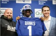  ?? STEFAN JEREMIAH/THE ASSOCIATED PRESS ?? New York Giants first-round draft pick Deonte Banks, center,is photograph­ed with head coach Brian Daboll, left, and general manager Joe Schoen during a press conference at the team’s training facility in East Rutherford, N.J., on Friday, April 28.