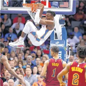  ??  ?? Oklahoma City’s Jerami Grant dunks the ball during Wednesday’s game with the Cleveland Cavaliers at the Chesapeake Energy Arena.