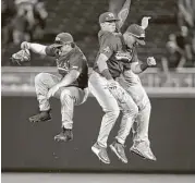  ?? Nati Harnik / Associated Press ?? TCU’s outfielder­s celebrate after their 9-2 win over Florida on Friday to force a rematch to decide which team advances to the College World Series finals.