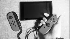  ?? — Washington Post photo by Hayley Tsukayama ?? The Joy-Con controller­s on the Nintendo Switch can detach from the screen.