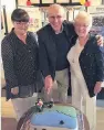  ??  ?? Cutting the cake Jimmy, Helen Begg and June Gibson