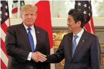  ?? - Reuters ?? WARM GREETINGS: U.S. President Donald Trump and Japan’s Prime Minister Shinzo Abe shake hands before a working lunch at Akasaka Palace in Tokyo, Japan on November 6, 2017.