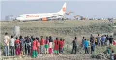  ?? EPA ?? A Boeing 737-900 from the the Malaysia-based airline Malindo Air sits idle after skidding off the runway at Tribhuvan Internatio­nal Airport in Kathmandu.