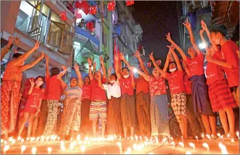  ??  ?? People take part in a noise campaign on the street after calls for protest against the military coup emerged on social media, in Yangon.