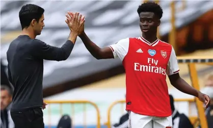  ?? Photograph: Michael Steele/AFP/Getty Images ?? Mikel Arteta’s advice to the 18-year-old Bukayo Saka is to savour being in the spotlight but be ready for the downside.