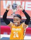  ??  ?? Team WNBA’s Arike Ogunbowale holds up the MVP trophy after Team WNBA defeated United States in a WNBA All-Star basketball game, on July 14, in Las Vegas. (AP)