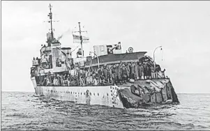  ?? CP PHOTO ?? Archival photo of HMCS Saguenay showing damage from being rammed by a merchant ship.