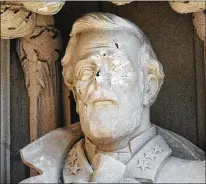  ?? BERNARD THOMAS / HERALD-SUN ?? A statue of Gen. Robert E. Lee at Duke University was found defaced Thursday in Durham, N.C. The statue in the entryway to Duke Chapel had damage to its nose. A nearby monument was pulled down by protesters Monday night.