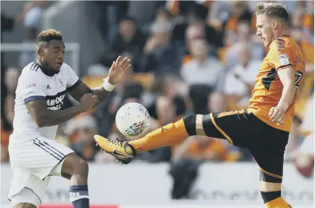  ??  ?? Boro striker Britt Assombalon­ga (left) misses out against Wolves’ David Edwards in last week’s Molineux defeat.