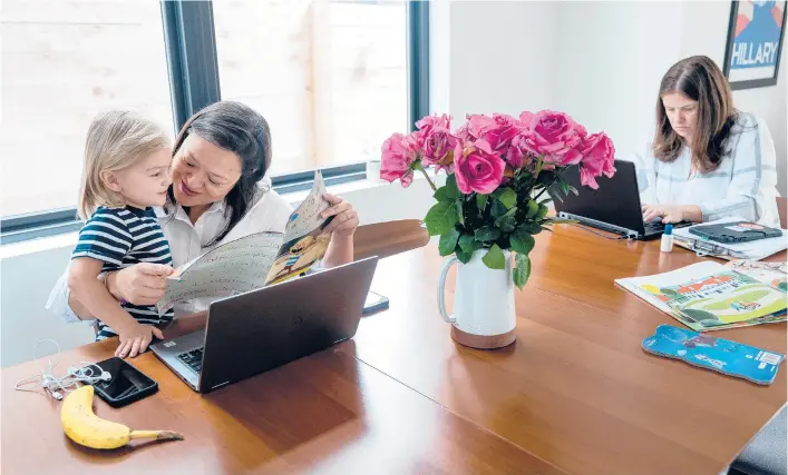  ?? ILANA PANICH-LINSMAN/THE NEW YORK TIMES ?? Emmy Ruiz works alongside her wife, Stephanie Grabow, right, and son, Henry, in their Austin, Texas, home.