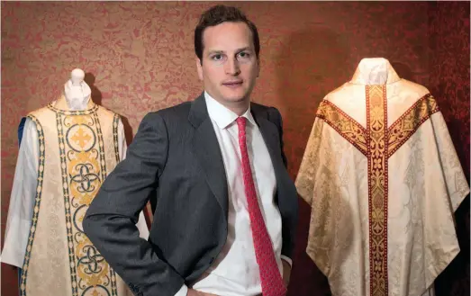  ??  ?? Robert Hoare with (left) Spanish-style Comper Cathedral silk chasuble, designed by Sir Ninian Comper (1864-1960), £3,500, and chasuble in cream Gothic silk damask with red Talbot brocade orphreys, £2,390. Below: a display case in the Watts showroom