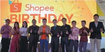  ??  ?? (right) At the e-commerce platform’s birthday event … Ho (fifth from left) with representa­tives of Shopee’s key brand partners. (below) Ho on Shopee providing a fuss-free and convenient shopping experience for consumers.