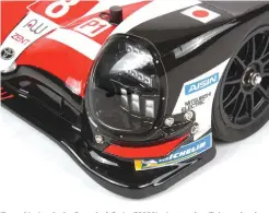  ??  ?? The multi-piece body allows the full-size TS050’S signature headlights under glass to be realistica­lly simulated. You can also see the bolt-on canards. Tamiya doesn’t miss a trick.