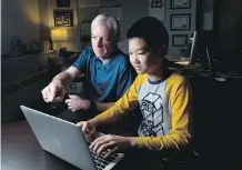  ?? LEAH HENNEL ?? Connect Charter School Grade 7 student Joseph Song hones his coding skills under the watchful eye of principal Phil Butterfiel­d.
