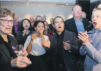  ?? BEN NELMS/SPECIAL TO POSTMEDIA NEWS ?? NPA City Council candidate Hector Bremner’s supporters watch the polls come in at his election night party in Vancouver on Saturday.