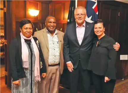  ?? Photo: Twitter/Scott Morrison ?? Papua New Guinea Prime Minister James Marape and his wife with his Australian counterpar­t Scott Morrison and wife Jenny.