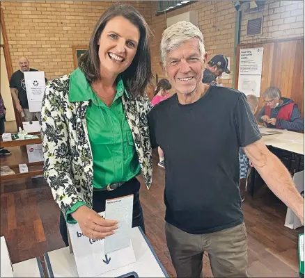  ?? ?? Proud: Annabelle Cleeland votes in Seymour with her proud father, Ian Beale.