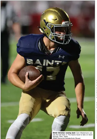  ?? (NWA Democrat-Gazette/Andy Shupe) ?? Shiloh Christian running back Cam Wiedemann carries the ball Sept. 4. The Saints travel to take on Sand Springs, Okla., today.