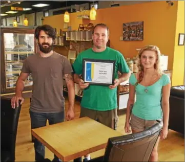  ?? GEOFF PATTON/THE REPORTER ?? OWNER CALEB Torrice, center, is shown at Tabora Cafe in Lansdale on Tuesday with employees Steve Gerczyk and Sarah Keyte. Tabora Cafe was chosen by the Lansdale Economic Developmen­t Committee as the Business of the Month for June.