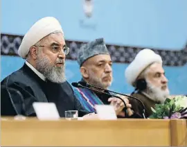  ?? HO / AFP ?? Rohani, ayer en Teherán, junto al líder de Hamas (derecha)