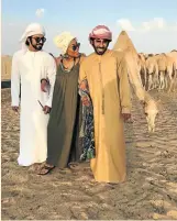  ?? MANTOMBI MAKHUBELE ?? CAMEL MEN: Rea Khoabane flanked by two of her guides on the desert safari in Abu Dhabi