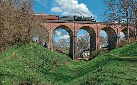  ?? JOHN TITLOW ?? With an afternoon train heading south, new Saint 4-6-0 No. 2999 Lady of Legend crosses Oldbury Viaduct on April 15.