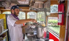  ?? Alexandra Wimley/Post-Gazette ?? Peter Williams, chef and general manager of the Revival Pasta food truck, prepares a dish last week by the U.S. Steel Tower, Downtown.