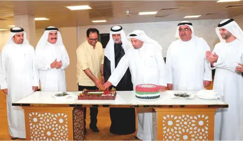  ?? Courtesy: Saleem Sanghati ?? Shaikh Nahayan cuts the UAE National Day celebratio­n cake at the Sharjah Cricket Stadium in the presence of Abdul Rehman ■ Bukhatir, Shaji Ul Mulk and Waleed Bukhatir.