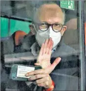  ?? REUTERS ?? Peter Ben Embarek, a member of the WHO’s probe team, waves from a bus while leaving the Wuhan Tianhe Internatio­nal Airport in China on Thursday.